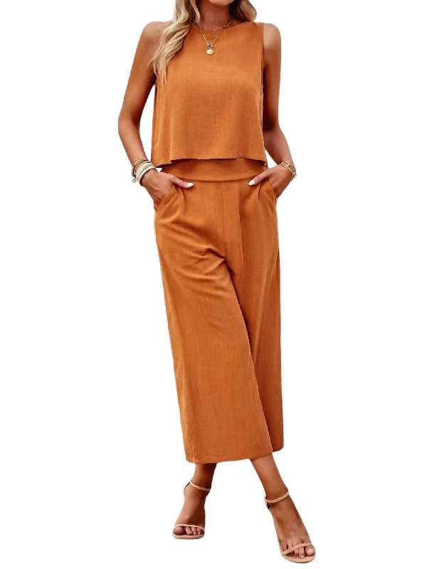 Statement tight trousers for women with bold color options for fashion-forward looks -Sleeveless Cropped Top And Wide Pants Set In Orange