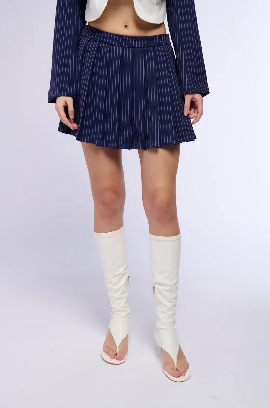 Flowy skirts for relaxed vacation wear -WHATS THE TEA PINSTRIPE PLEATED MINI SKIRT IN NAVY